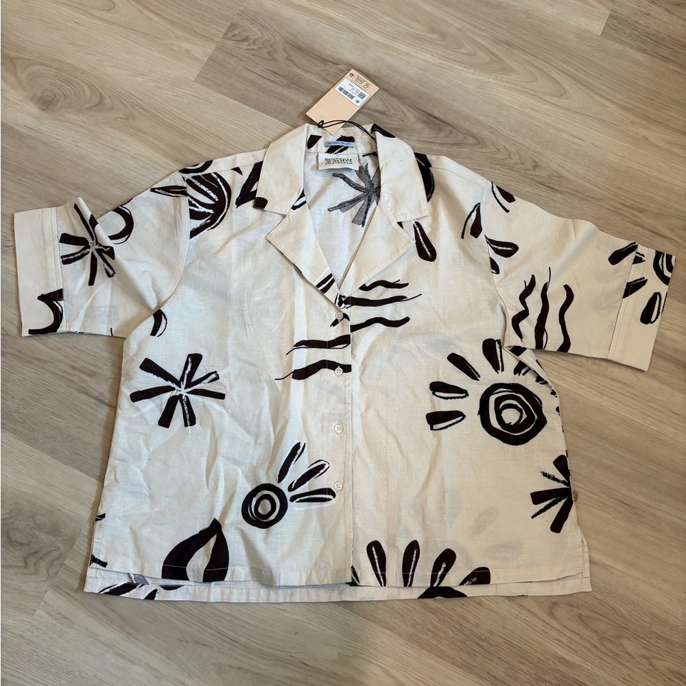 Linen women’s oversized button down collared shirt with floral design